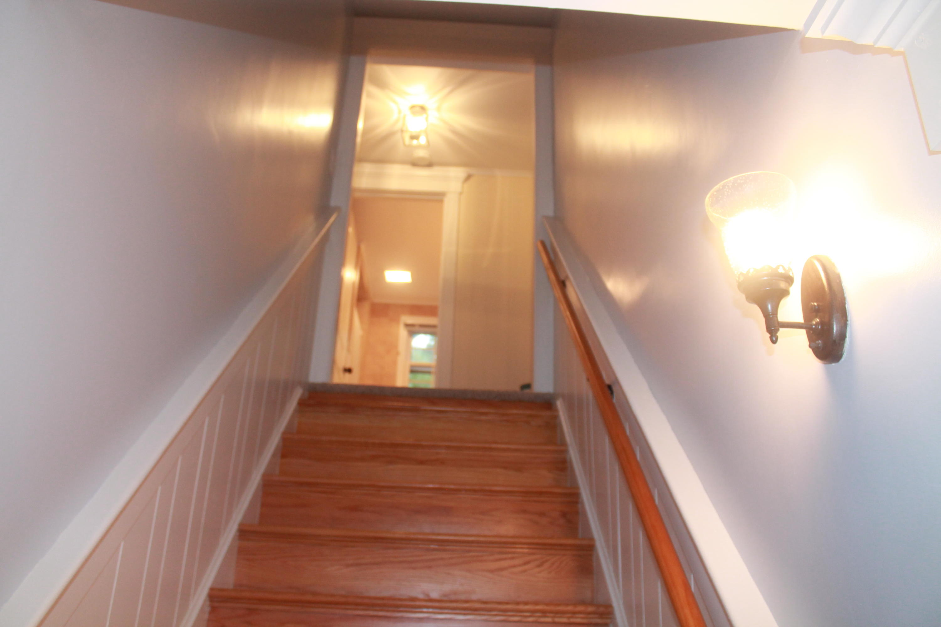 4 Frederick Road Falmouth, MA 02540 - Photo 10 of 27 a view of a hallway with wooden floor and staircase