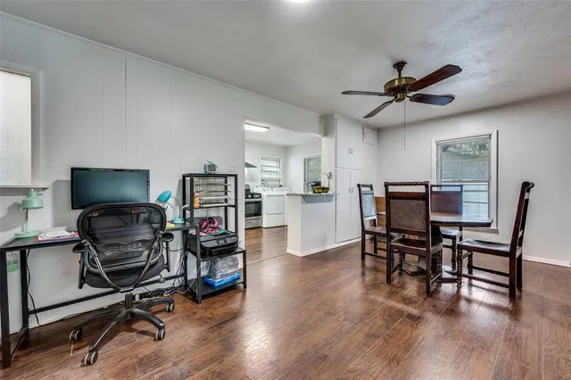 a view of a livingroom with furniture and a flat screen tv