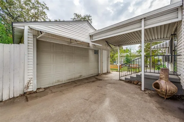 a view of a car park in front of house