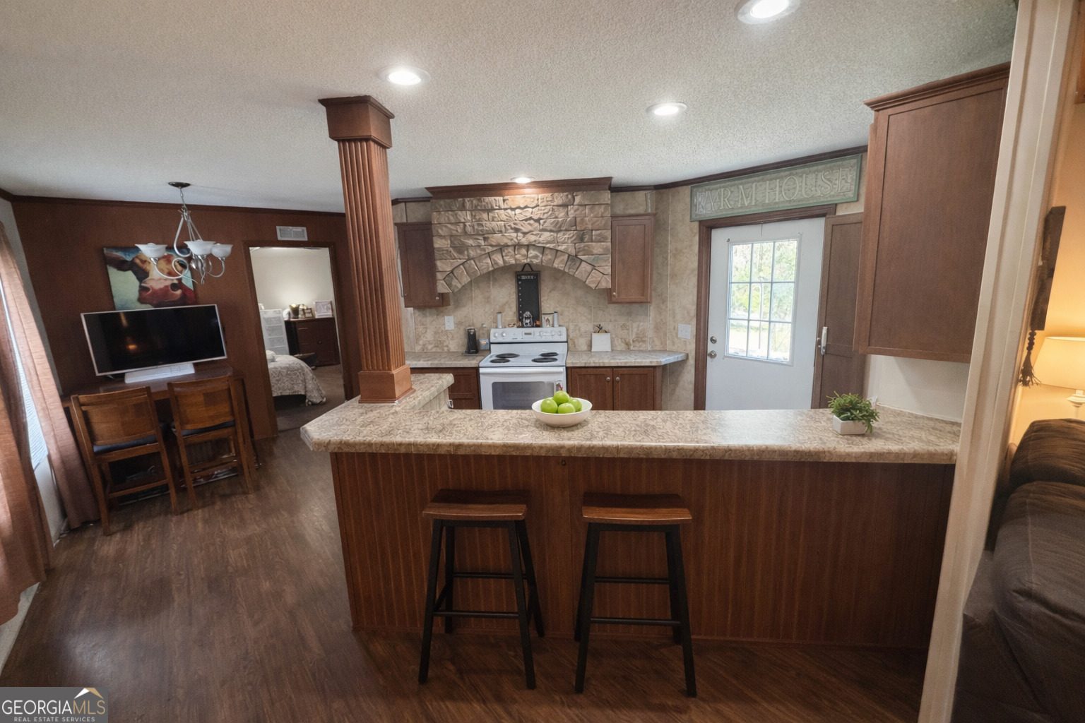 2811 Lyons Center Road Lyons, GA 30436 - Photo 3 of 9 a kitchen with a table and chairs in it