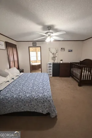 a bedroom with a bed and dresser