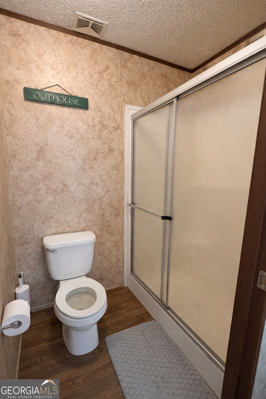 2811 Lyons Center Road Lyons, GA 30436 - Photo 7 of 9 a white toilet sitting next to a bathroom sink