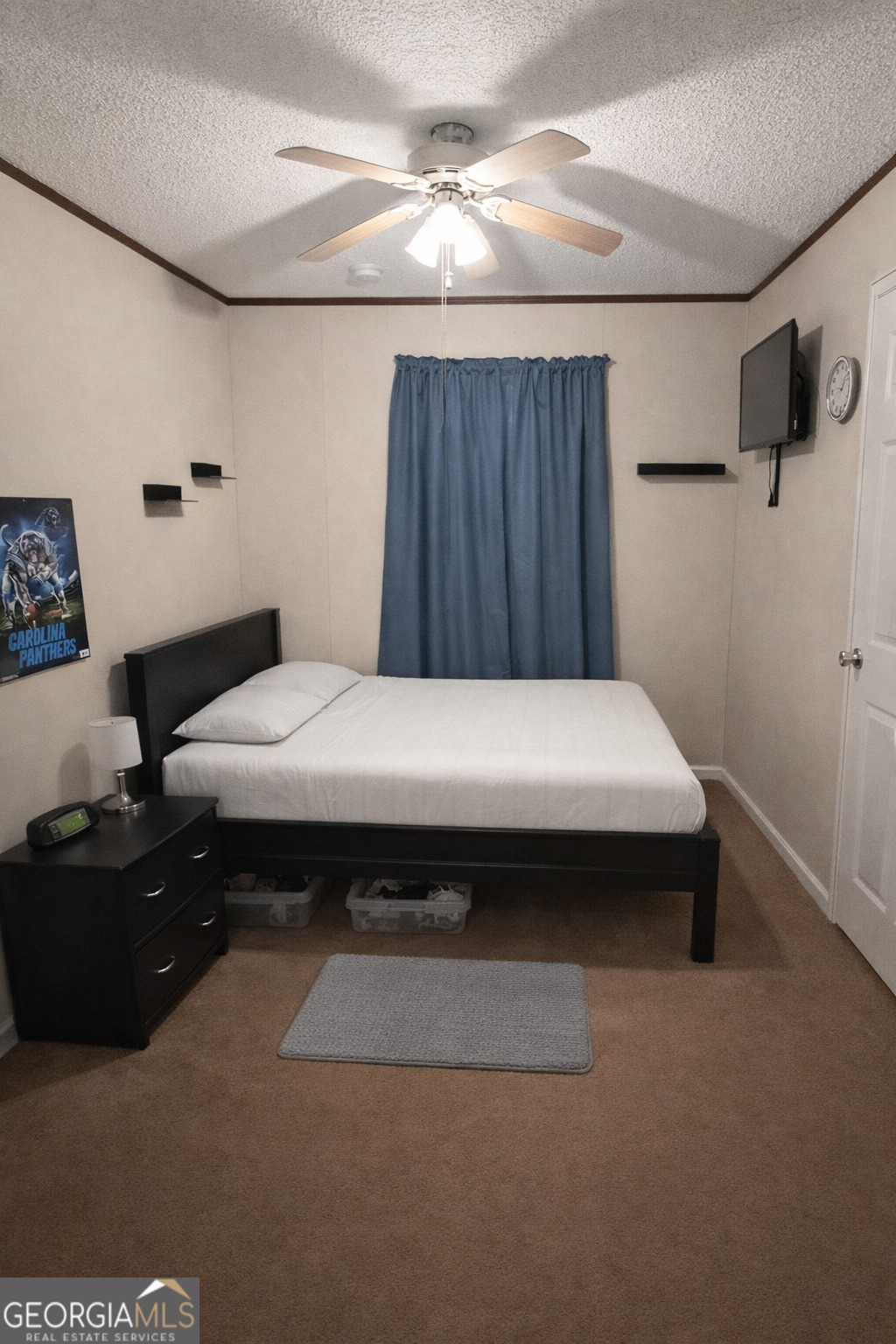 2811 Lyons Center Road Lyons, GA 30436 - Photo 9 of 9 a bedroom with a bed and a cabinets