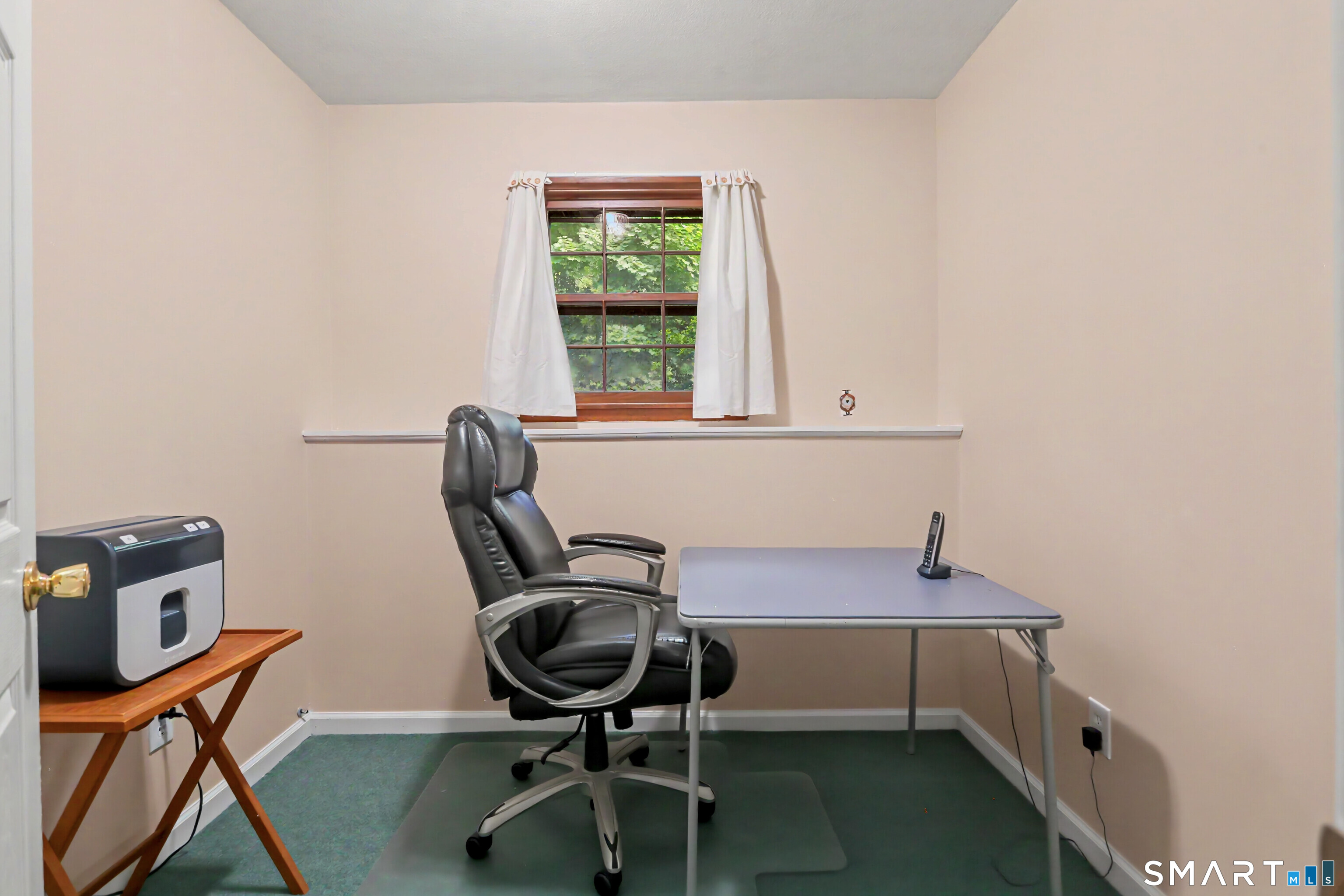 632 Wheelers Farm Road Orange, CT 06477 - Photo 27 of 39 a view of a workspace with furniture and a window