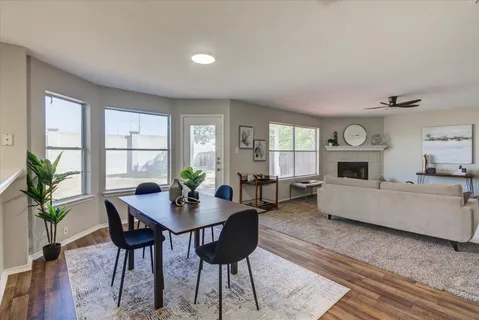 a kitchen with cabinets stainless steel appliances a sink and a window