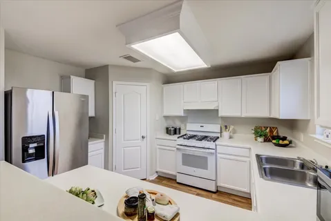 a bathroom with a sink a mirror and shower