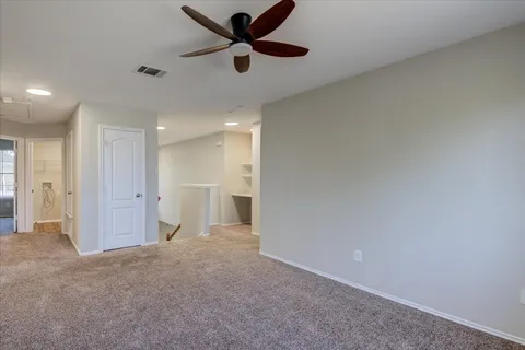 a bed room with a bed and a couch