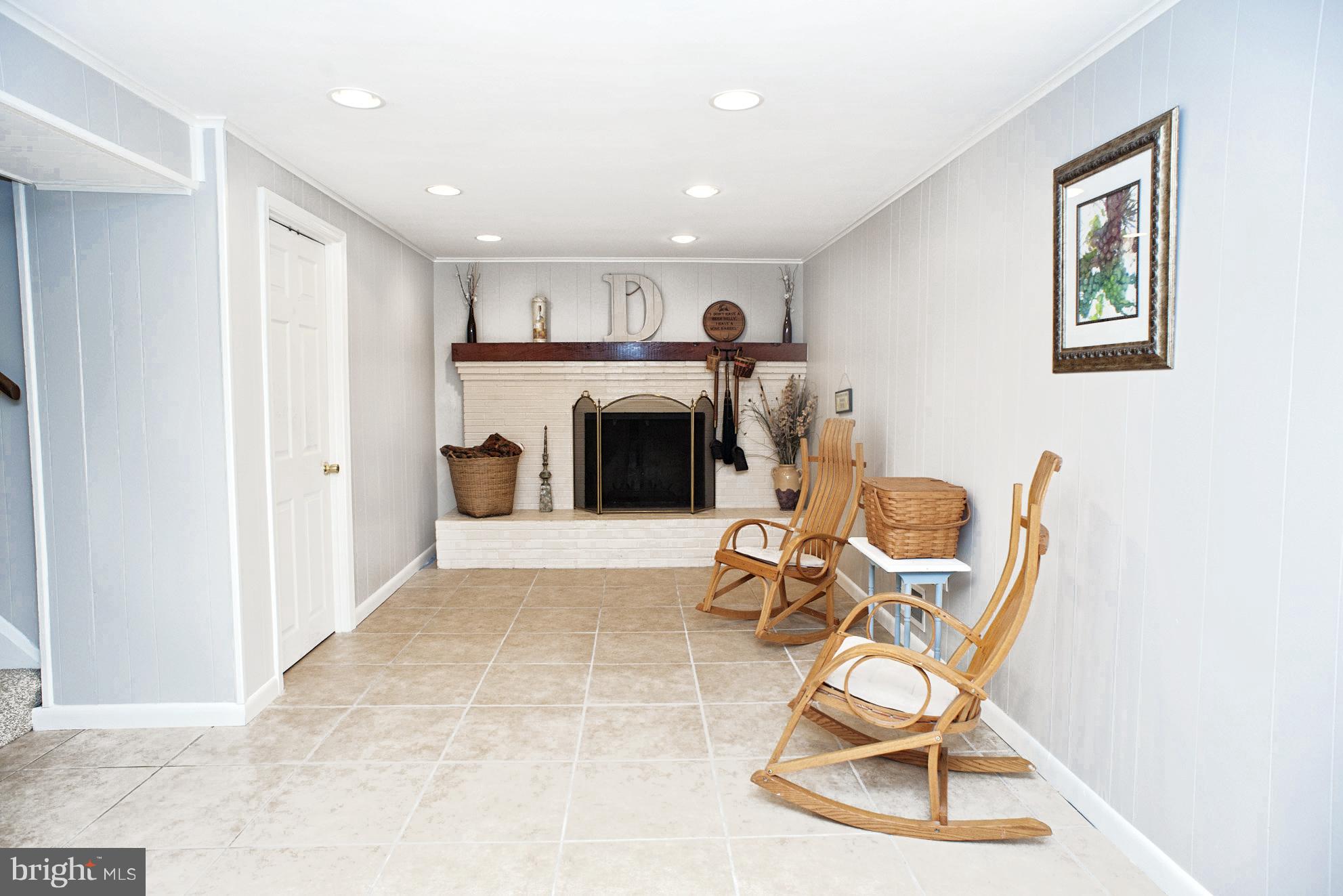 11525 Johns Hopkins Road Fulton, MD 20759 - Photo 22 of 29 Lower Level Rec Room with Wood Burning FP