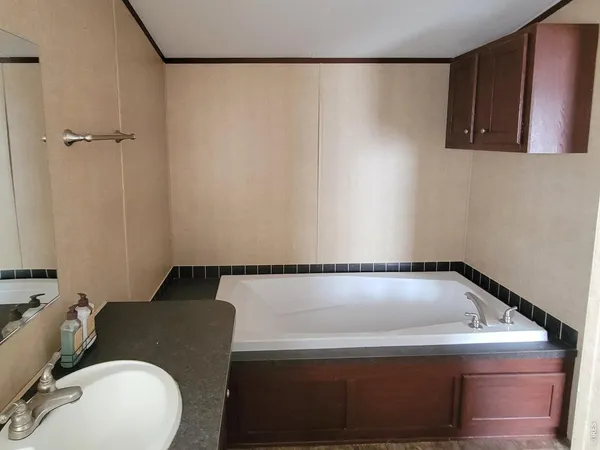 a bathroom with a bathtub and a toilet