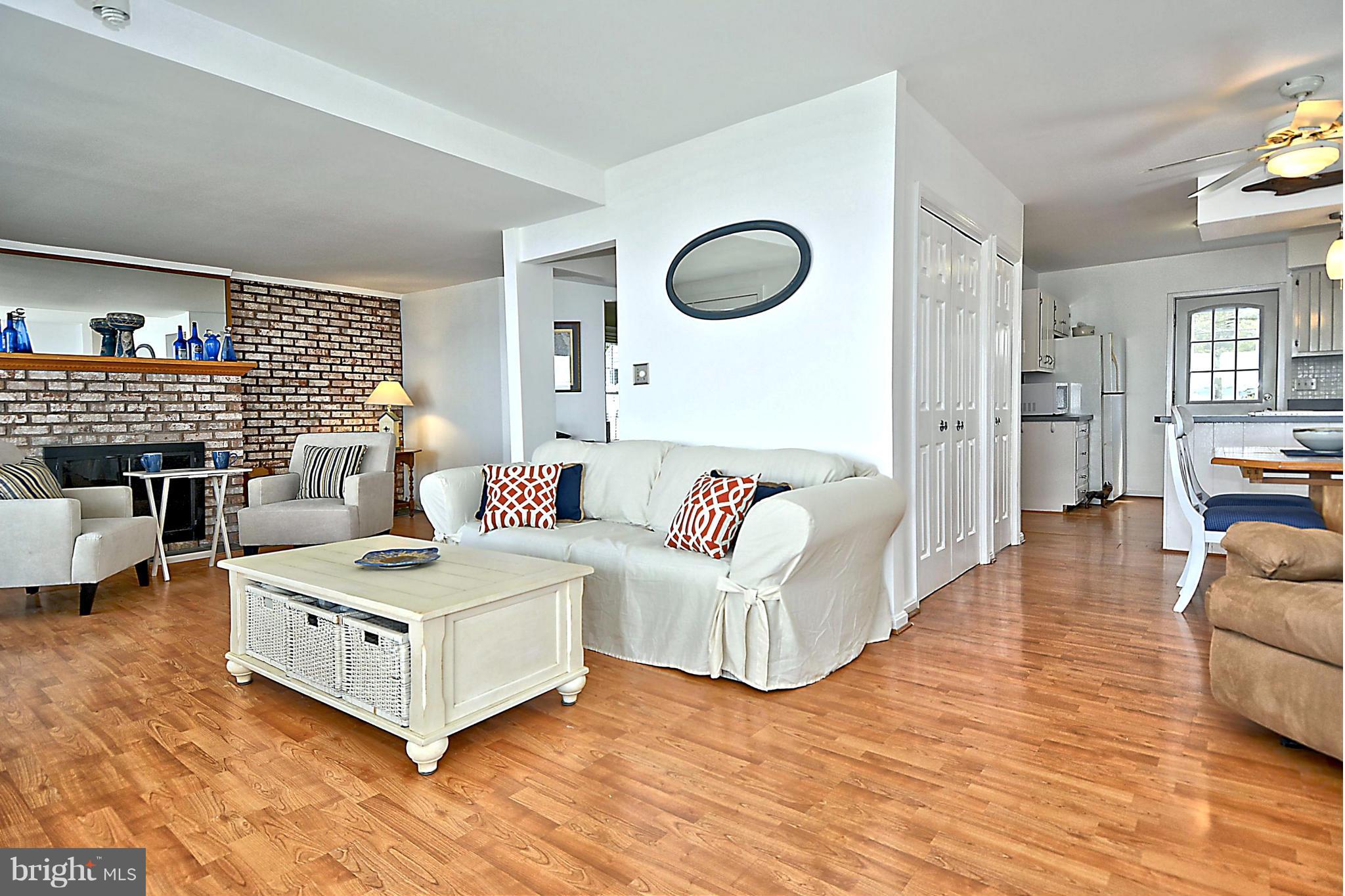 1071 Shore Acres Road Arnold, MD 21012 - Photo 12 of 30 Seamless Flow into Light-Filled Living Room