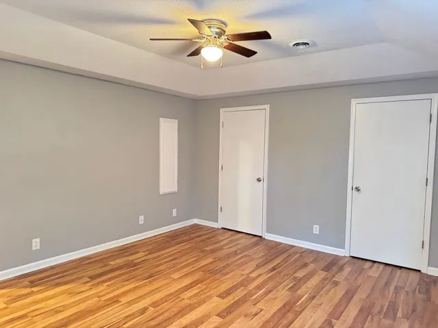 a view of room with window and ceiling fan