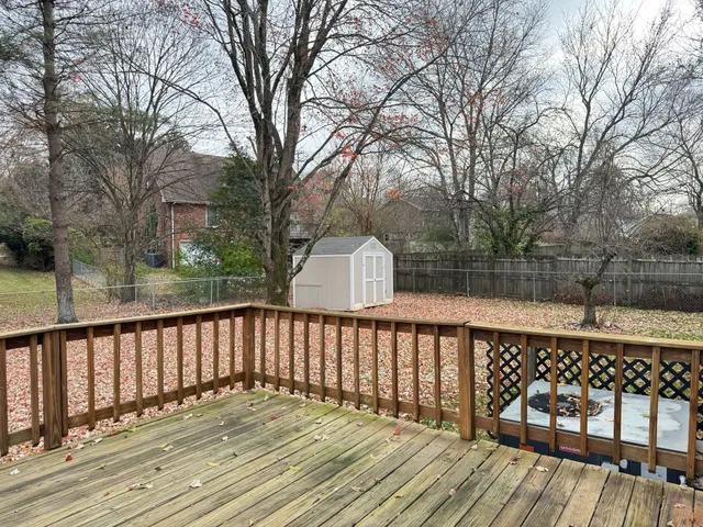 a view of wooden deck and a trees
