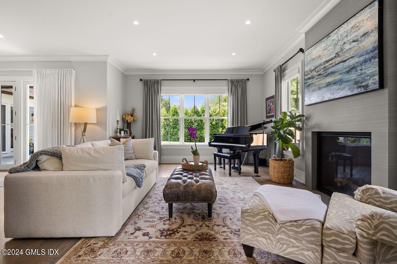 106 Lockwood Road Riverside, CT 06878 - Photo 11 of 38 a living room with furniture and a fireplace
