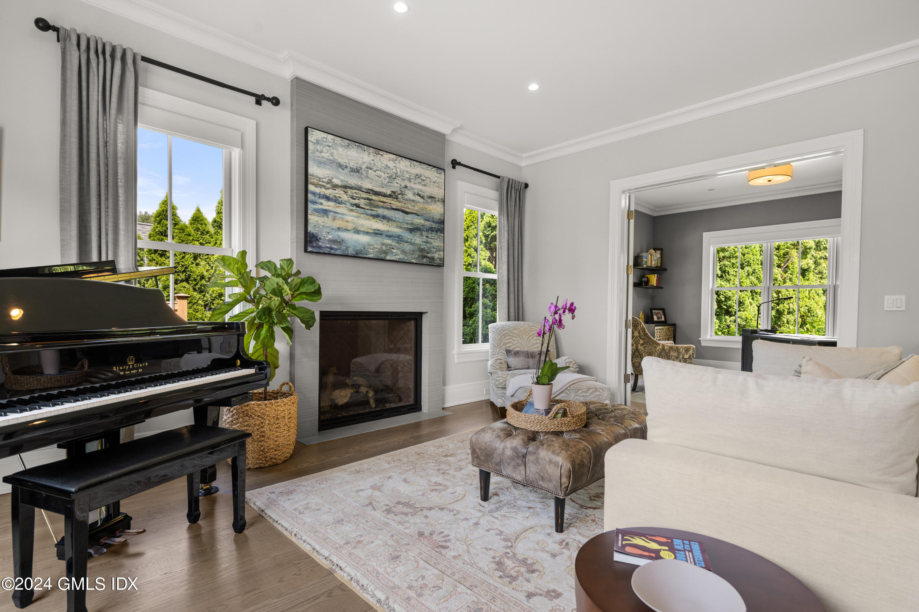106 Lockwood Road Riverside, CT 06878 - Photo 12 of 38 a living room with furniture and a fireplace
