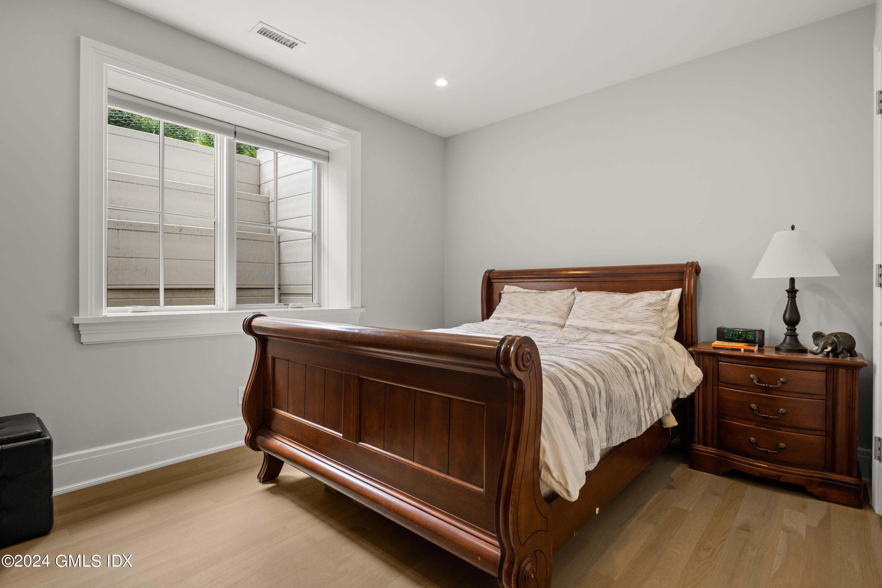 106 Lockwood Road Riverside, CT 06878 - Photo 29 of 38 a bedroom with a bed and a window