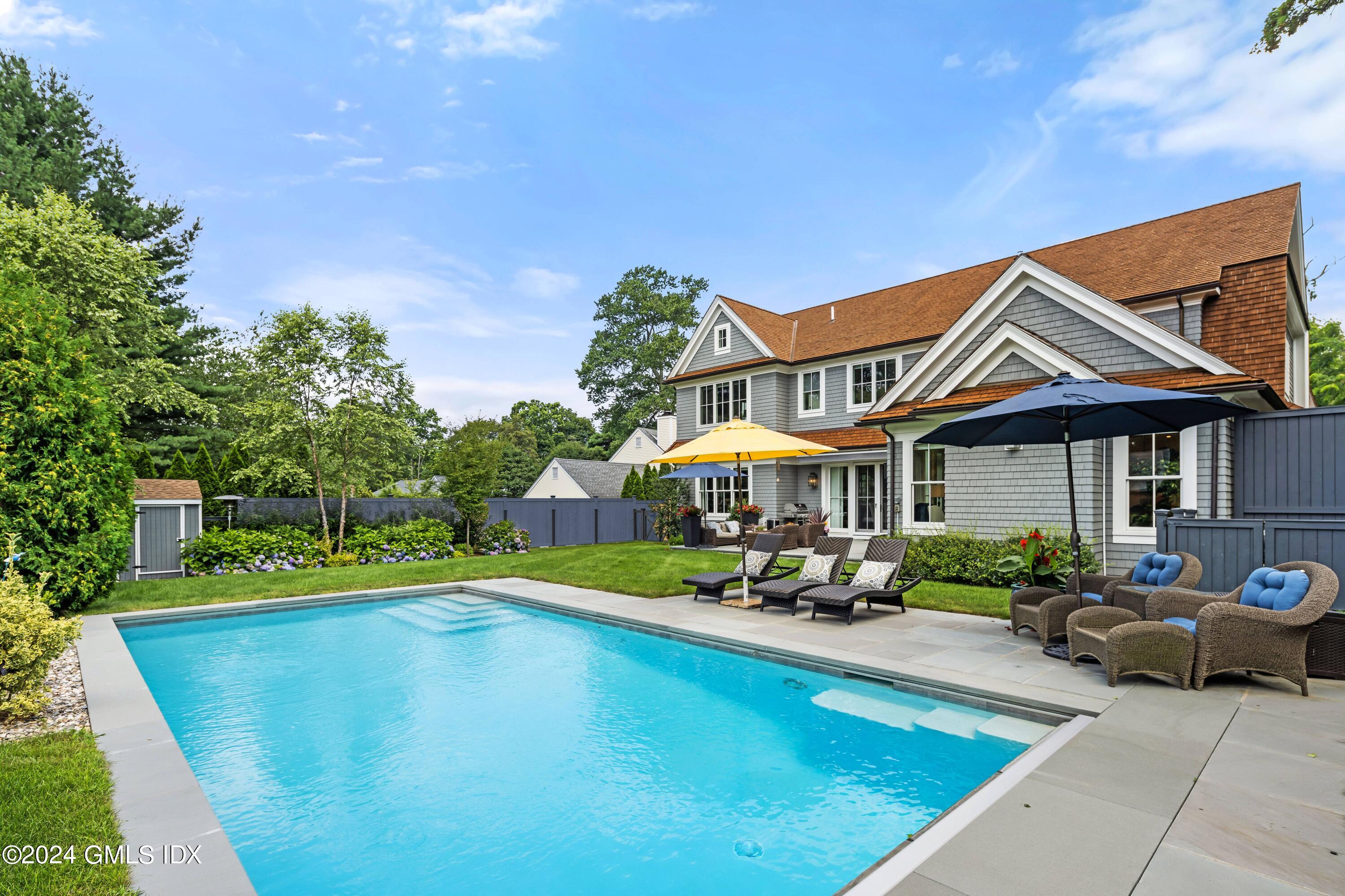 106 Lockwood Road Riverside, CT 06878 - Photo 32 of 38 a view of a house with a backyard porch and sitting area
