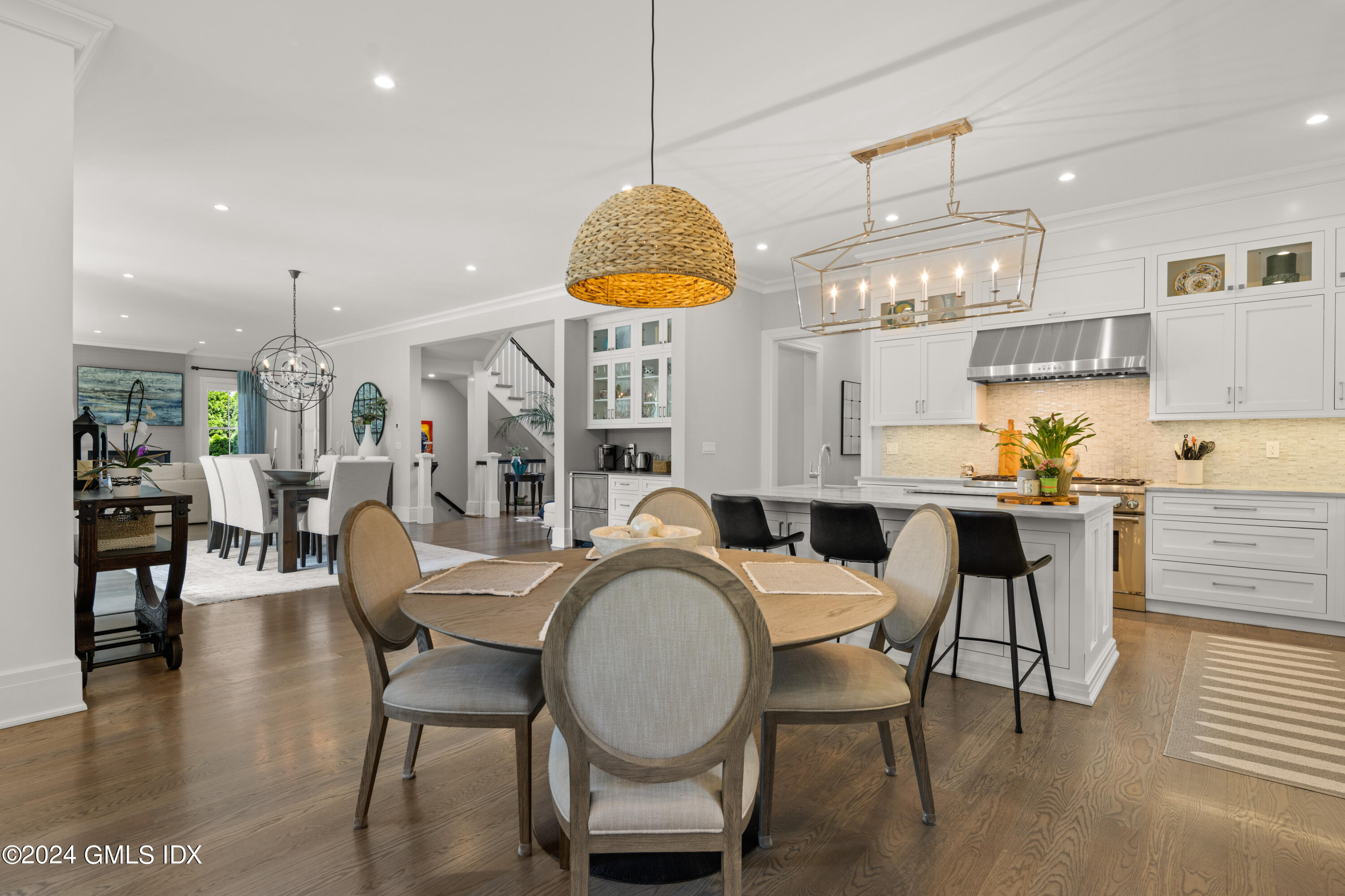 106 Lockwood Road Riverside, CT 06878 - Photo 8 of 38 a dining room with furniture and a chandelier