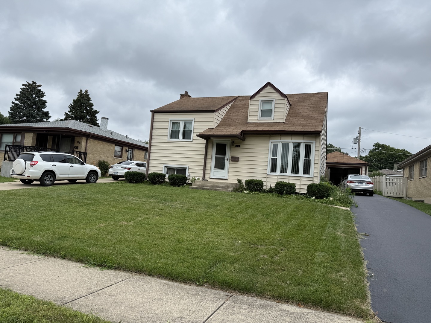 49 North Martha Street Lombard, IL 60148 - Photo 1 of 1 a front view of a house with a garden and plants