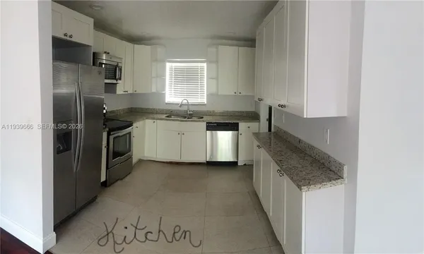 an empty room with wooden floor