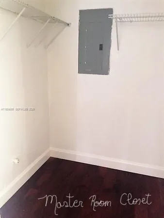 a bathroom with a sink toilet and mirror