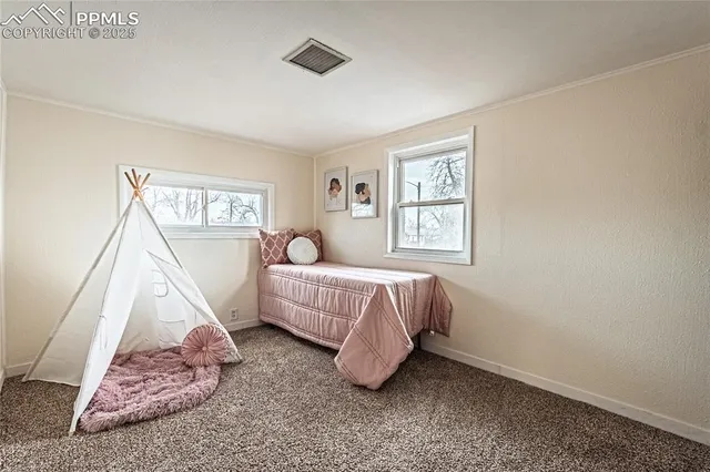 a bed room with a bed and a window