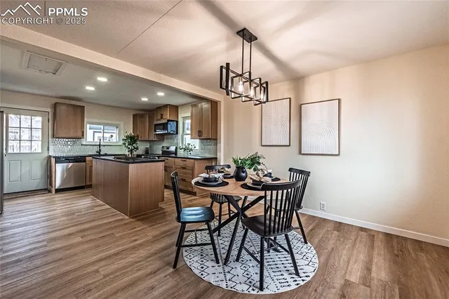 a view of a dining room with furniture window and wooden floor