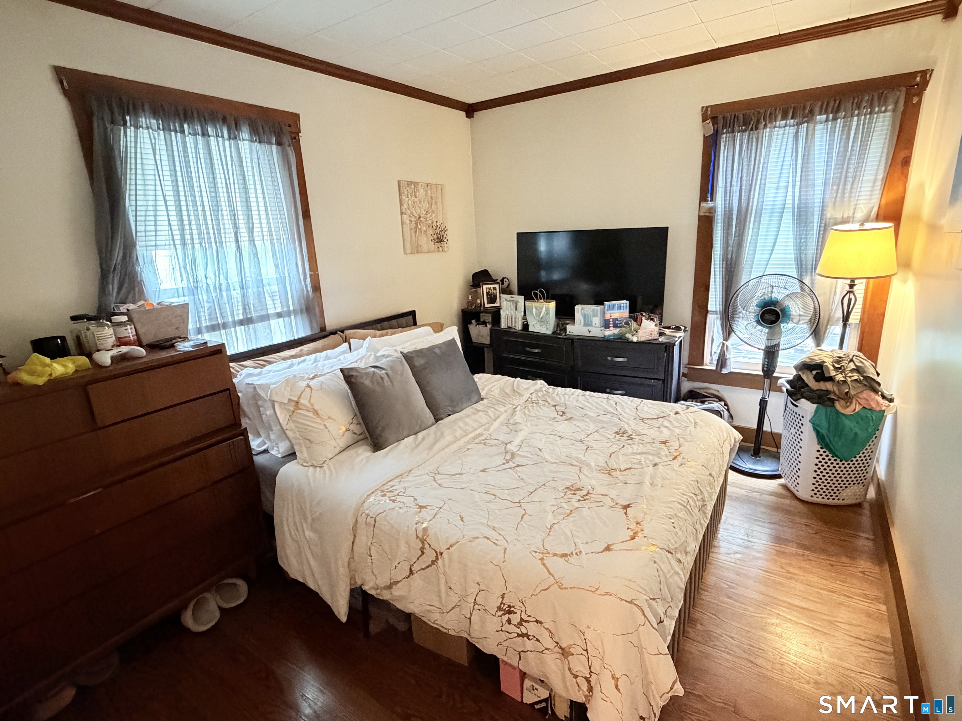 67 Pine Street Meriden, CT 06451 - Photo 8 of 34 a bedroom with a bed and large windows