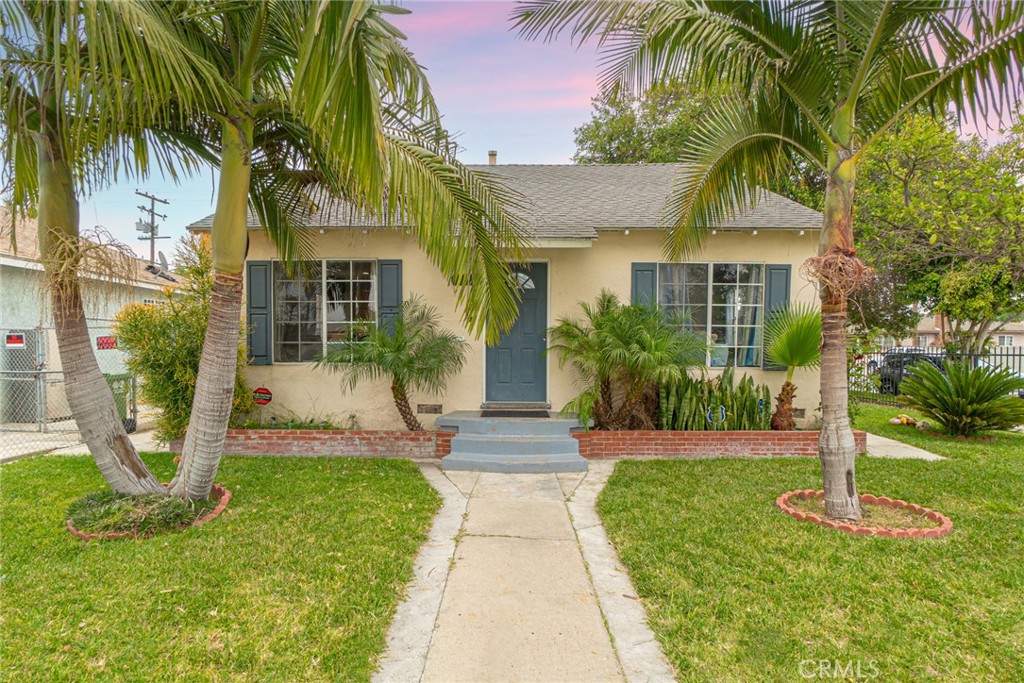 1957 East Killen Place Compton, CA 90221 - Photo 1 of 1 a front view of a house with garden