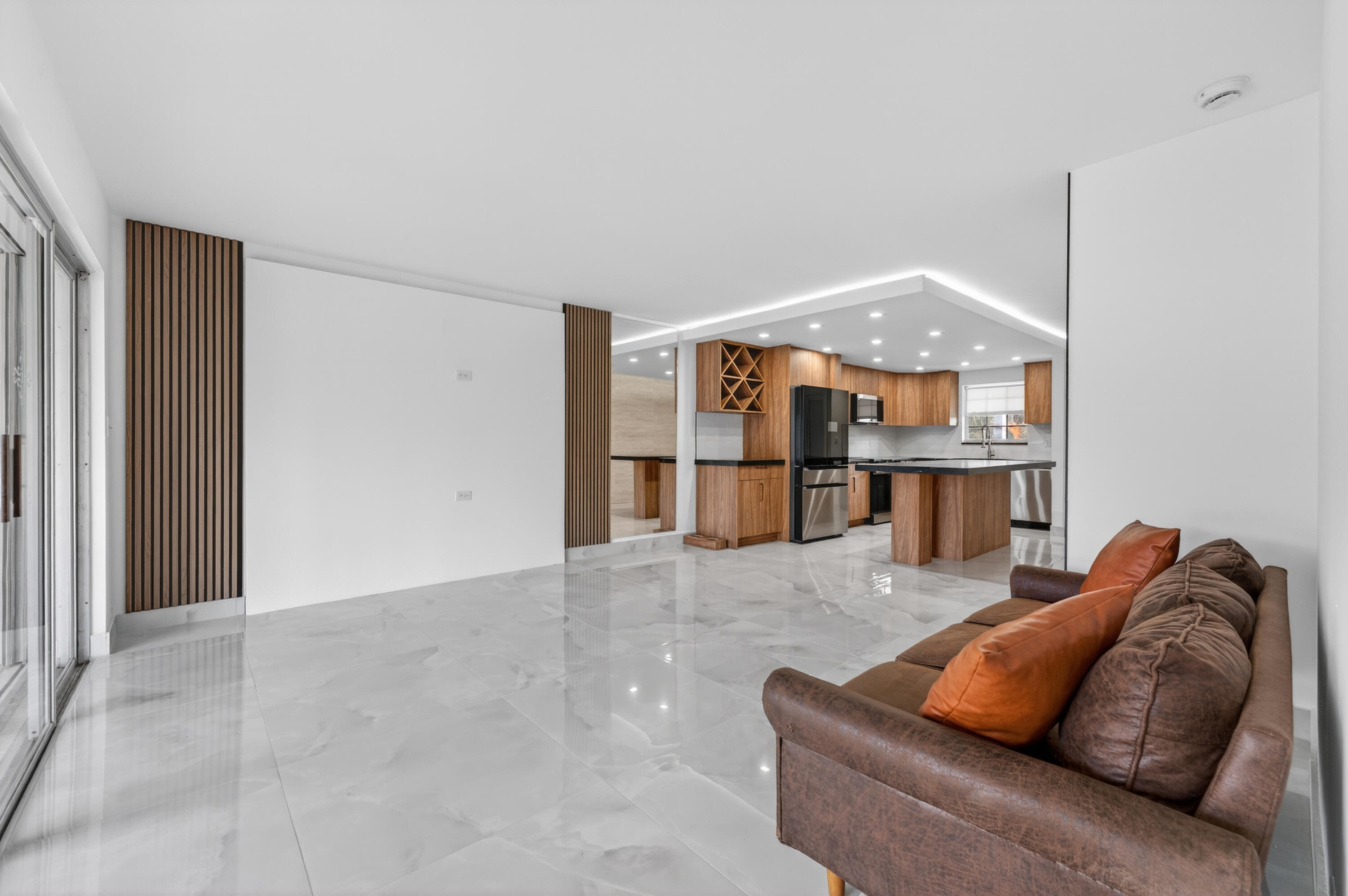 2134 Northeast 36th Street, Unit 82 Lighthouse Point, FL 33064 - Photo 16 of 38 a living room with furniture and a window