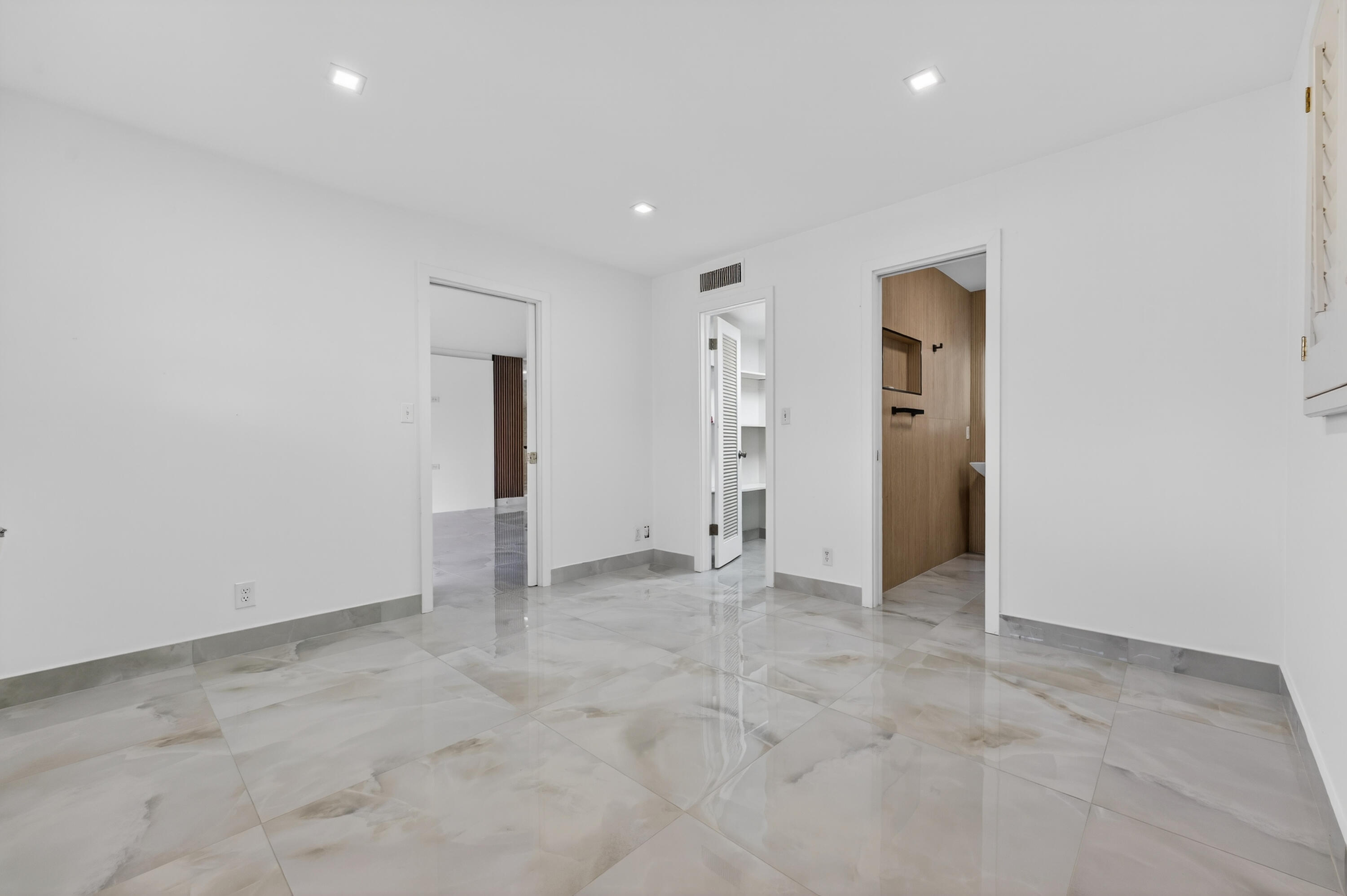 2134 Northeast 36th Street, Unit 82 Lighthouse Point, FL 33064 - Photo 20 of 38 an empty room with an entryway