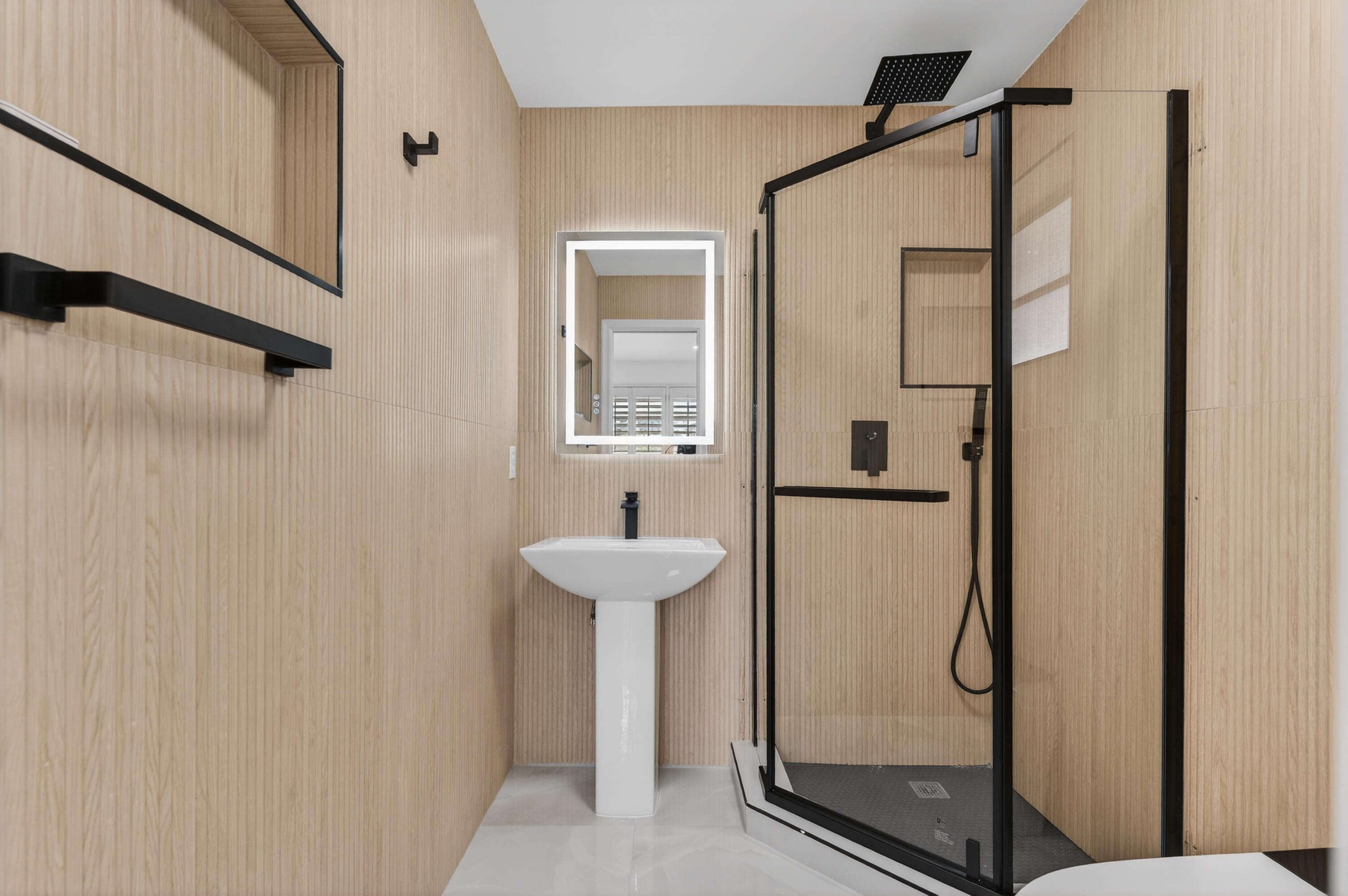 2134 Northeast 36th Street, Unit 82 Lighthouse Point, FL 33064 - Photo 22 of 38 a bathroom with a shower and a sink