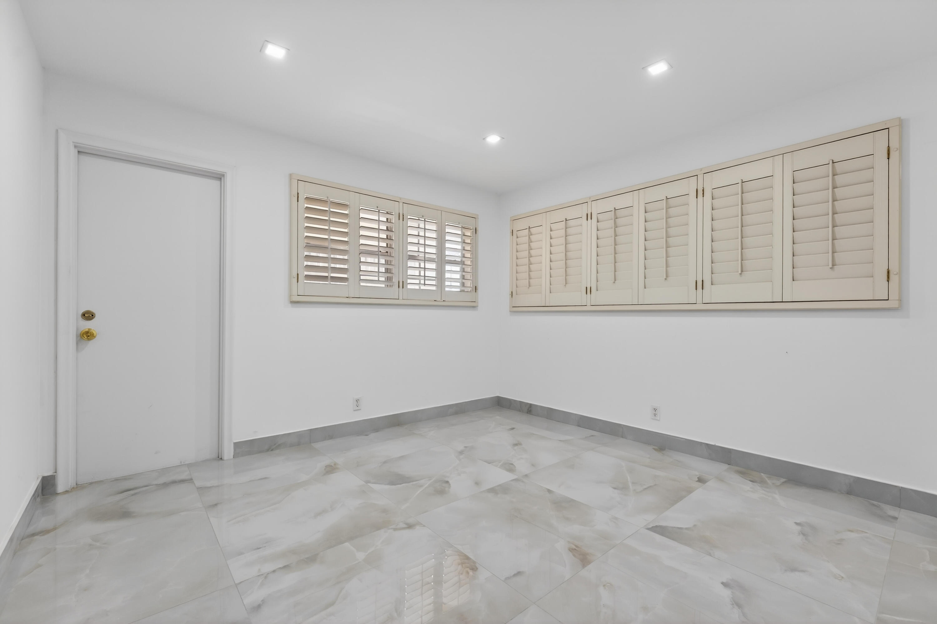 2134 Northeast 36th Street, Unit 82 Lighthouse Point, FL 33064 - Photo 24 of 38 an empty room with a window