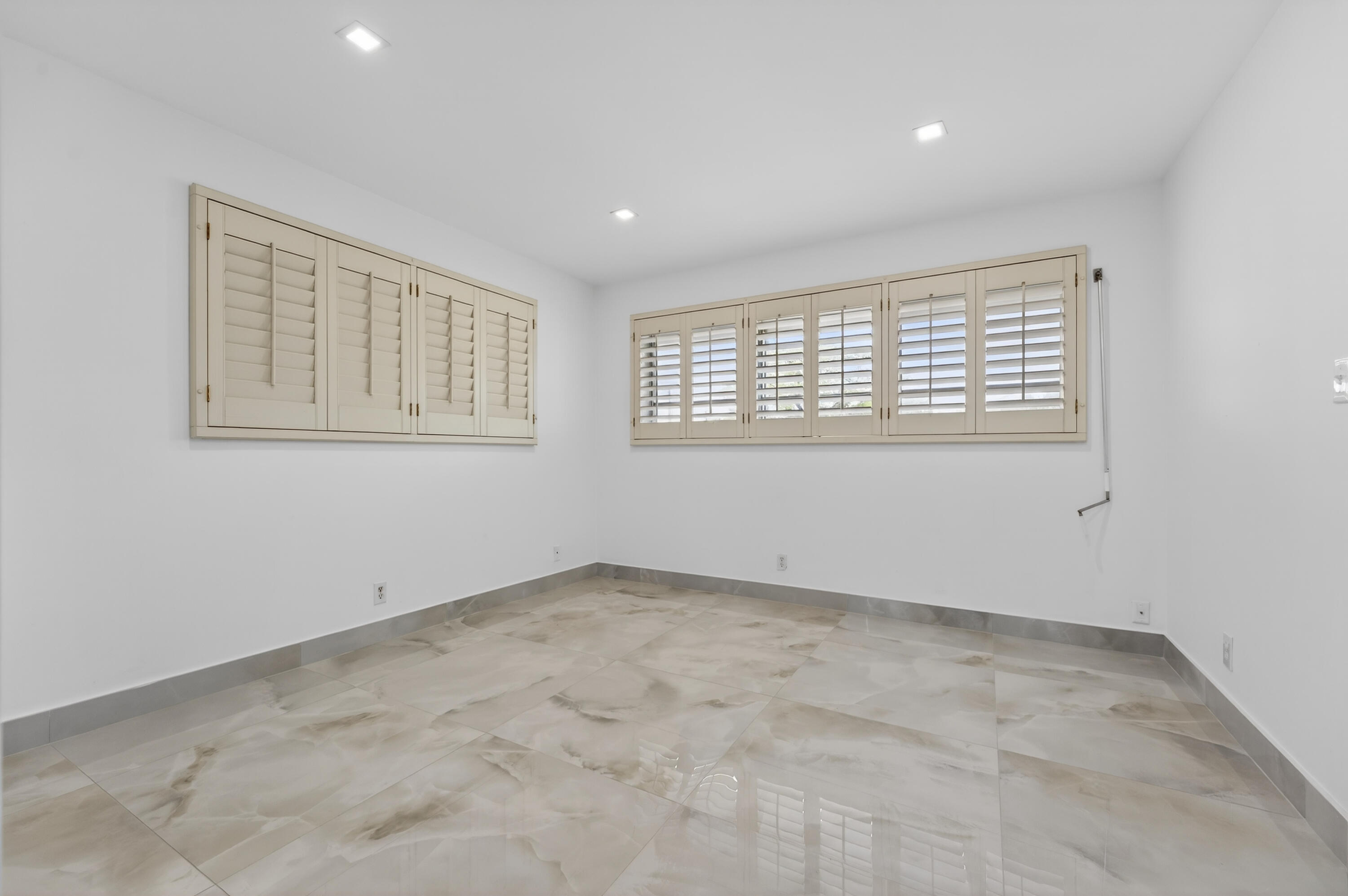 2134 Northeast 36th Street, Unit 82 Lighthouse Point, FL 33064 - Photo 25 of 38 an empty room with a window