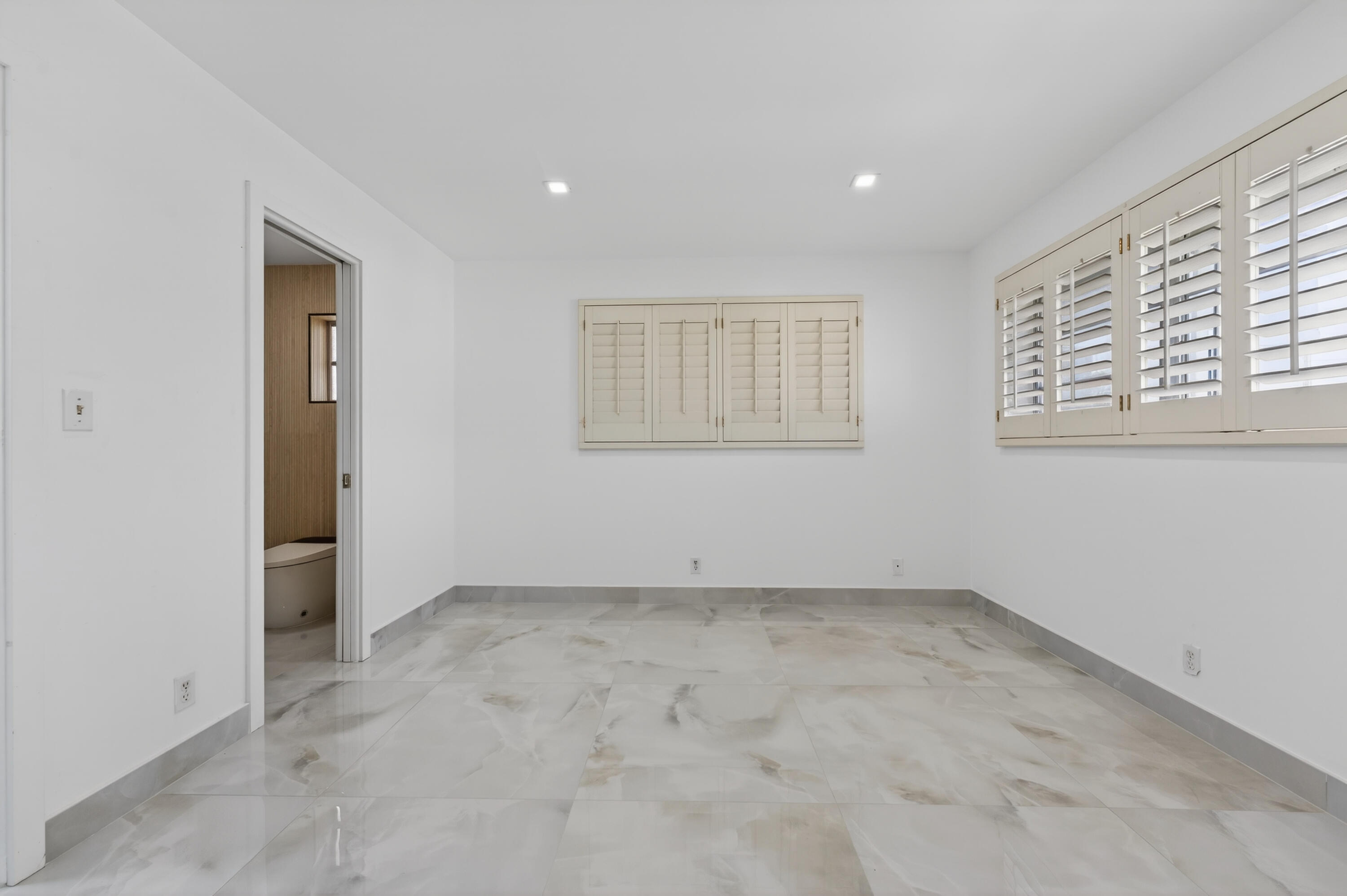 2134 Northeast 36th Street, Unit 82 Lighthouse Point, FL 33064 - Photo 26 of 38 an empty room with a window