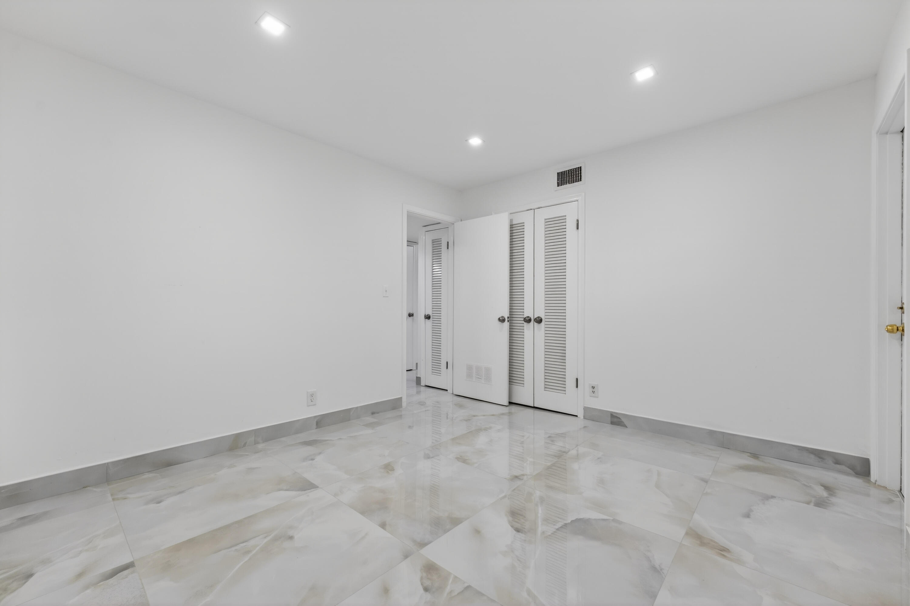 2134 Northeast 36th Street, Unit 82 Lighthouse Point, FL 33064 - Photo 27 of 38 a view of an empty room