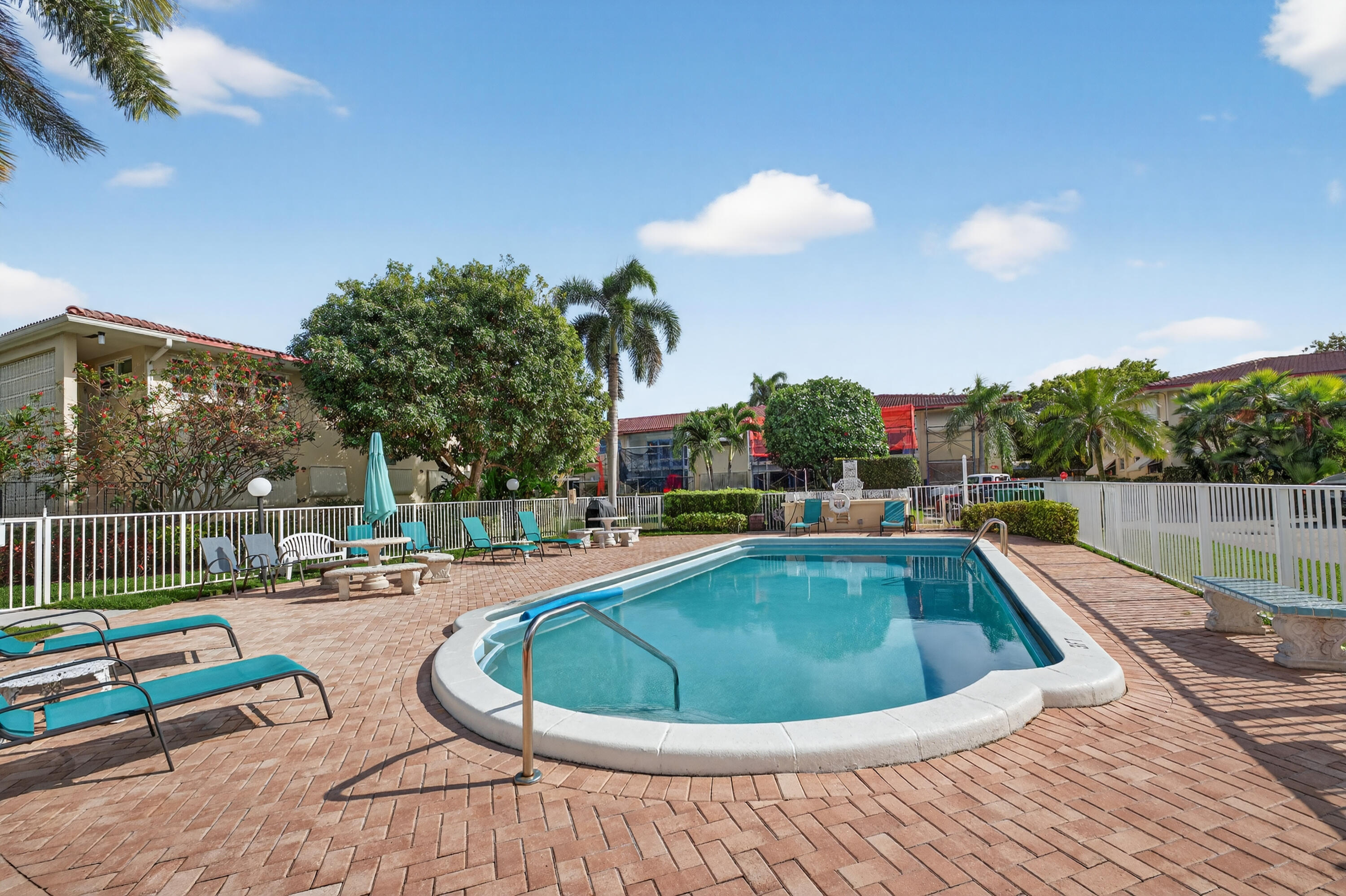 2134 Northeast 36th Street, Unit 82 Lighthouse Point, FL 33064 - Photo 36 of 38 a view of swimming pool having outdoor seating