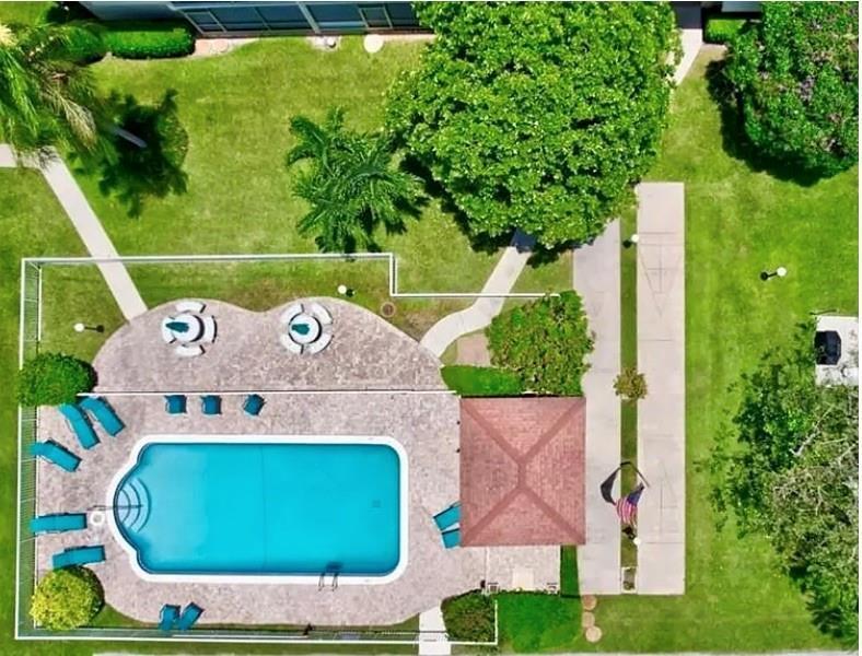 2134 Northeast 36th Street, Unit 82 Lighthouse Point, FL 33064 - Photo 37 of 38 an aerial view of a house with garden space and street view