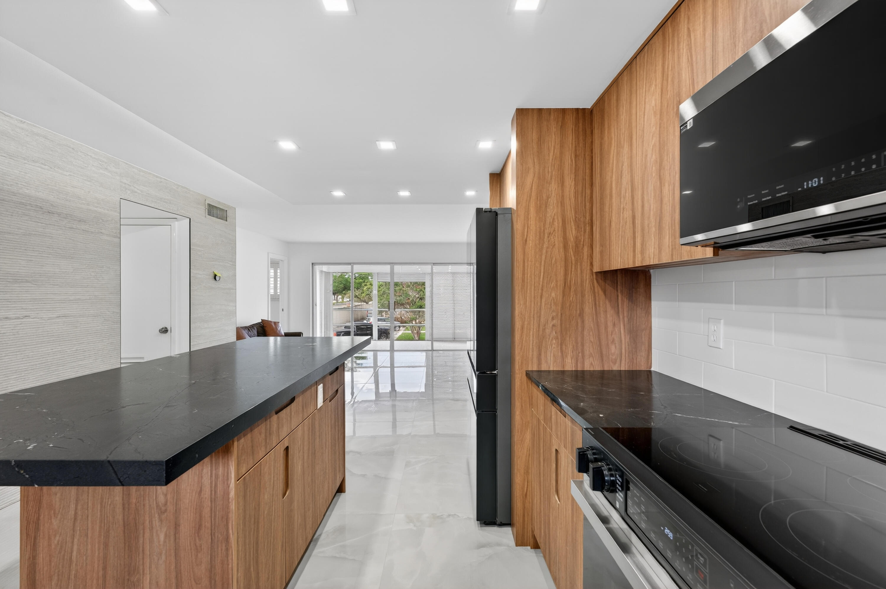 2134 Northeast 36th Street, Unit 82 Lighthouse Point, FL 33064 - Photo 6 of 38 a kitchen with counter top space and a sink
