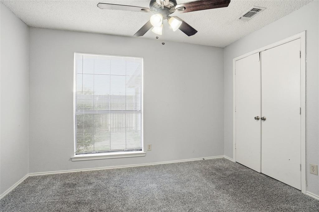 6720 Crestmont Court Fort Worth, TX 76133 - Photo 13 of 16 a view of an empty room with a window