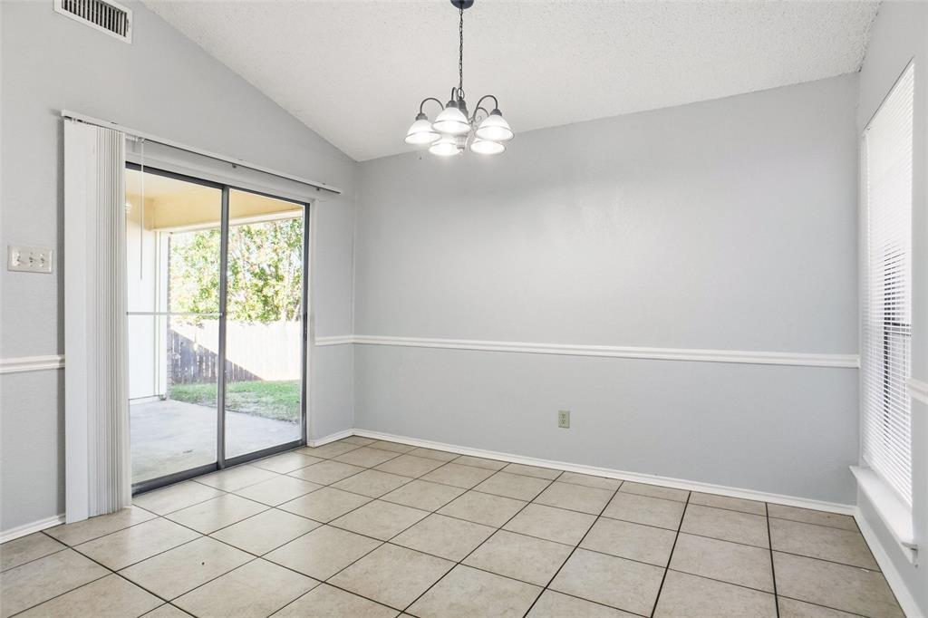 6720 Crestmont Court Fort Worth, TX 76133 - Photo 5 of 16 a view of an empty room with a window
