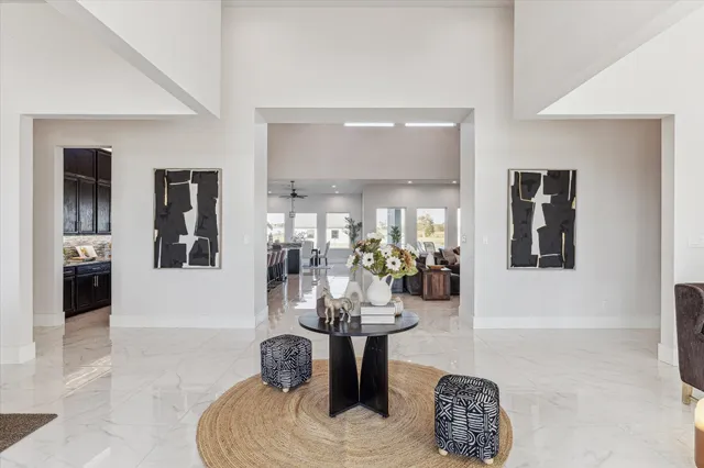 a living room with fireplace furniture and decor