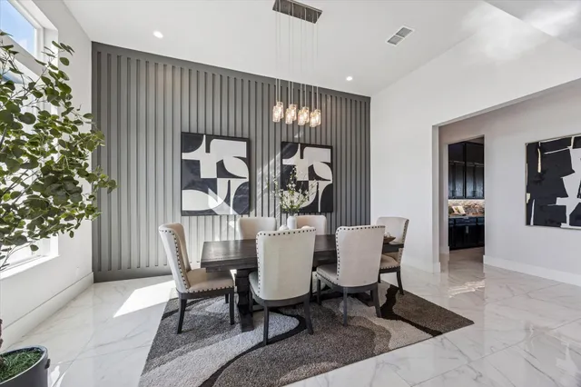 a dining room with furniture and window