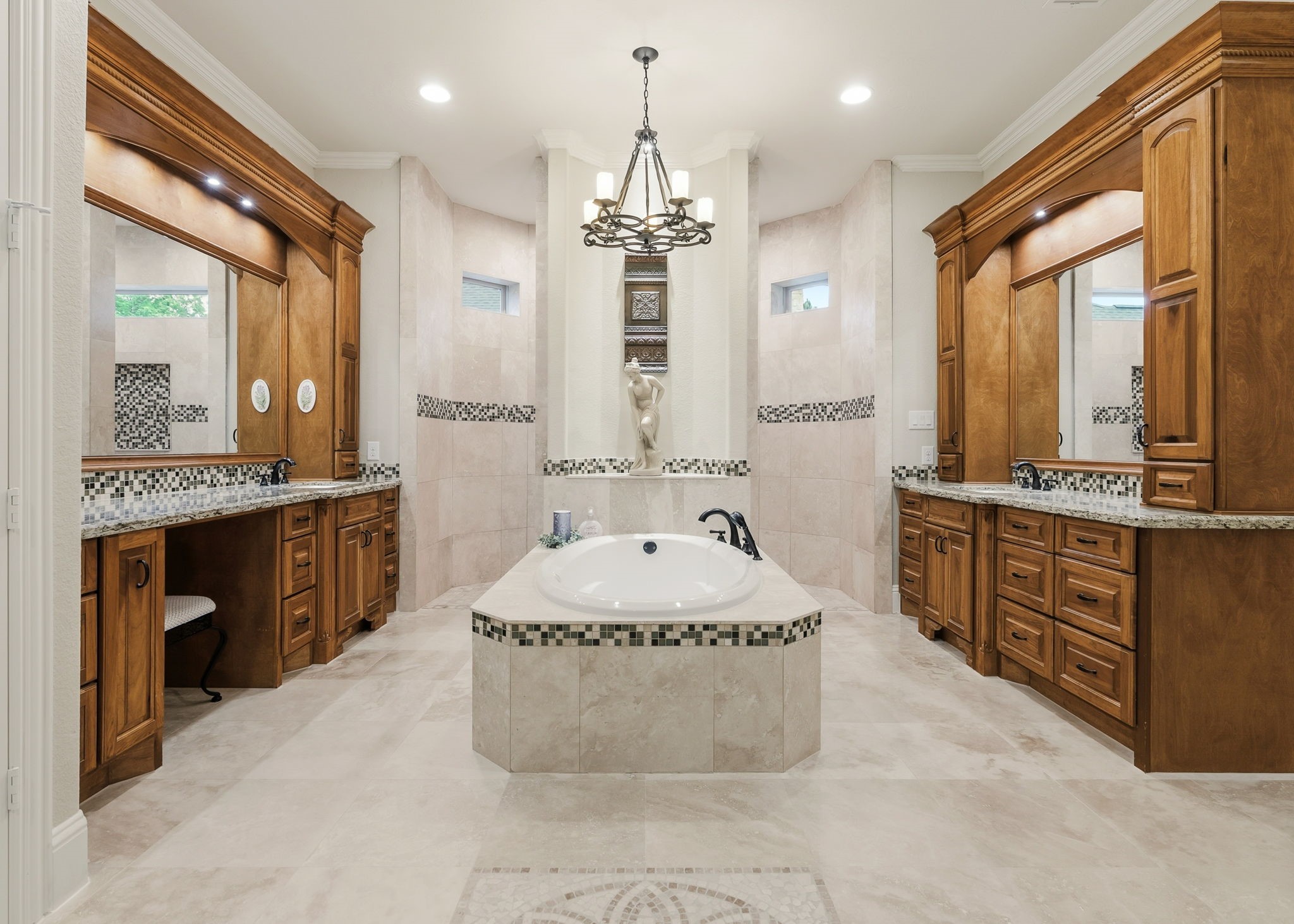 28502 Crawford Ridge Court Huffman, TX 77336 - Photo 25 of 50 a spacious bathroom with a granite countertop sink mirror and a bathtub