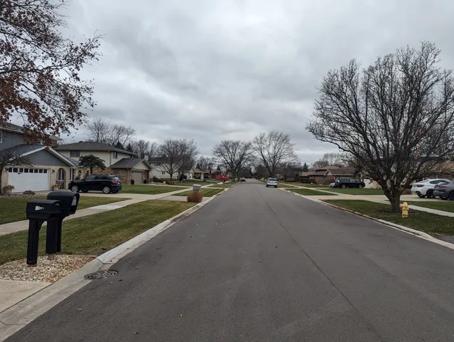 a view of street with houses