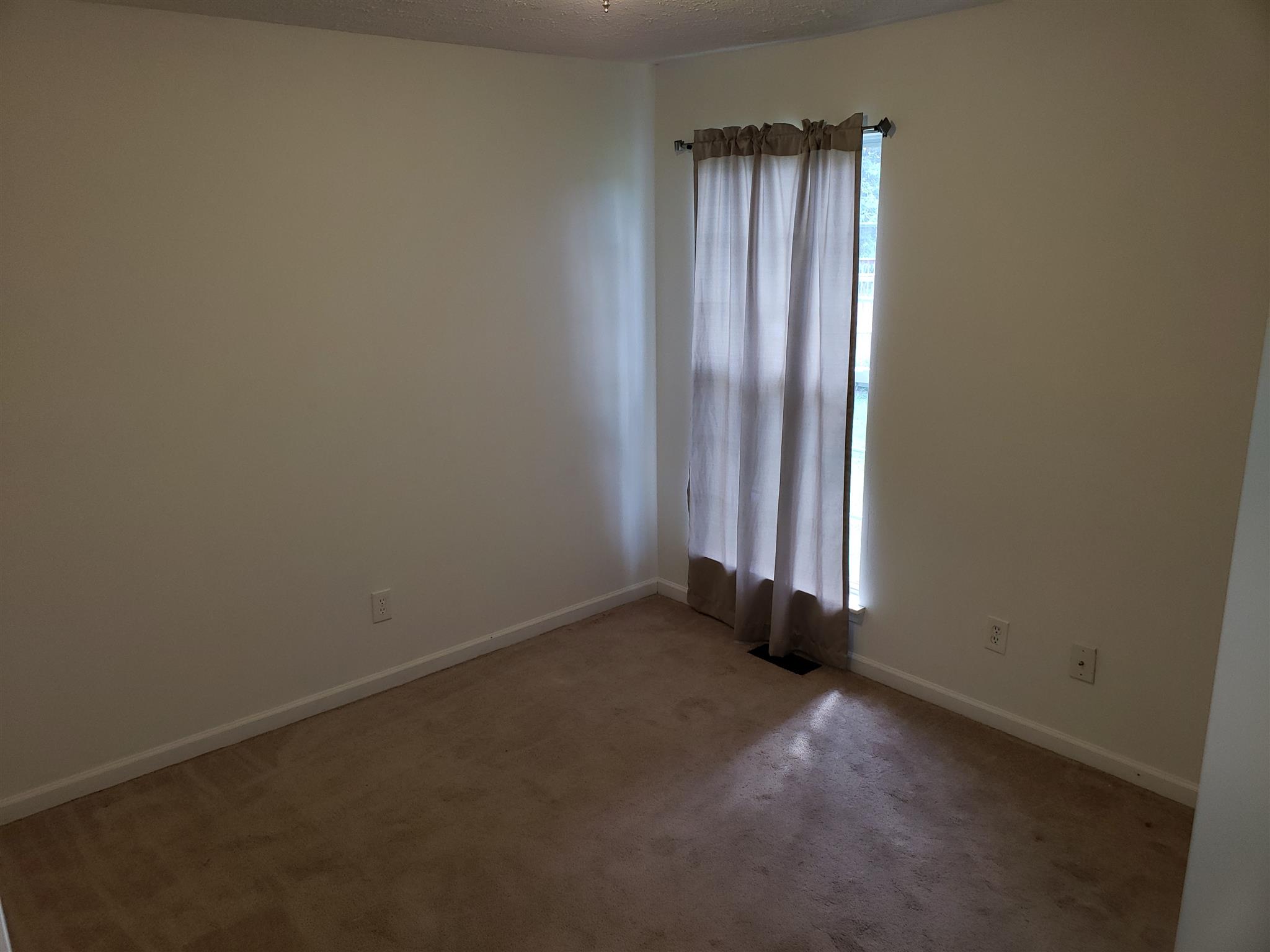 582 Windy Road Mount Juliet, TN 37122 - Photo 2 of 10 an empty room with windows