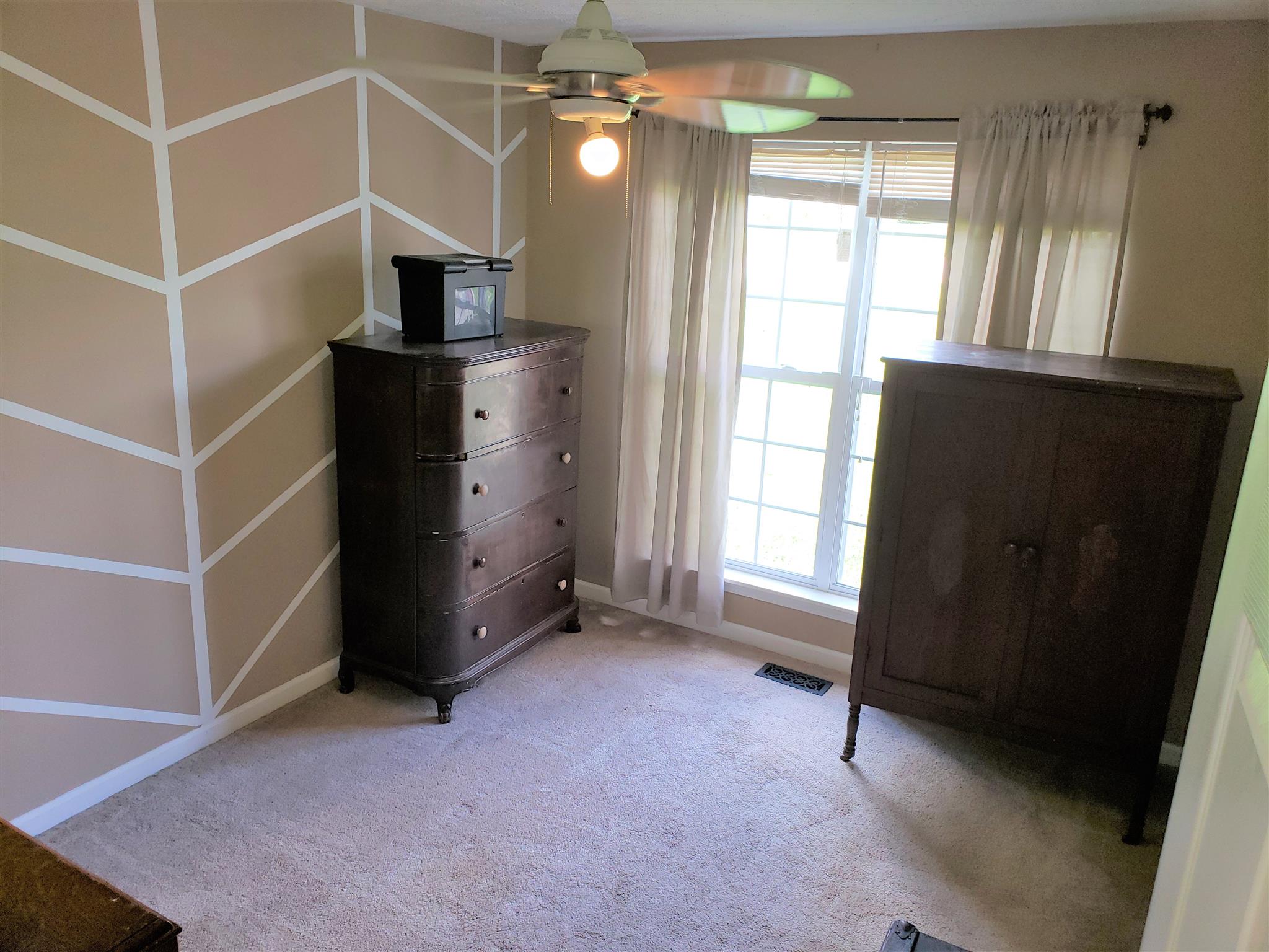 582 Windy Road Mount Juliet, TN 37122 - Photo 9 of 10 an empty room with windows and cabinet