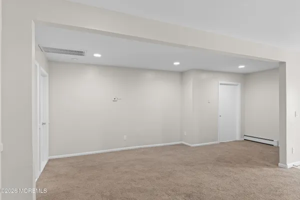 a bathroom with a toilet and shower