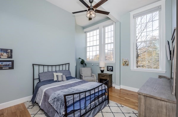 52 Sanborn Street, Unit 102 Reading, MA 01867 - Photo 21 of 28 a bedroom with a bed a window and dresser