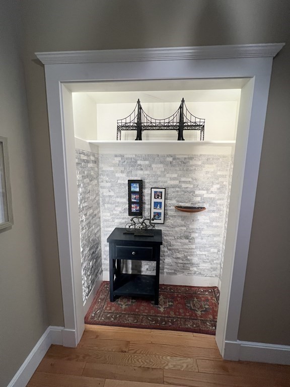 52 Sanborn Street, Unit 102 Reading, MA 01867 - Photo 3 of 28 a living room with furniture and a fireplace