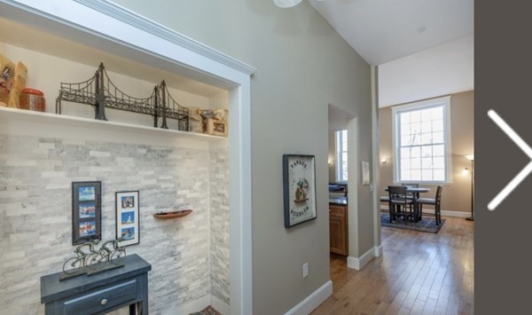 52 Sanborn Street, Unit 102 Reading, MA 01867 - Photo 4 of 28 a living room with furniture and wooden floor